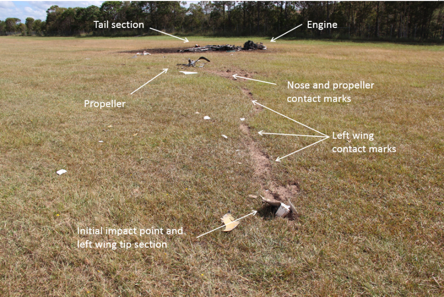 Figure 14: Main wreckage and accident site looking north-north-west, showing the left wing point of impact in the foreground and the fuselage and engine in the background