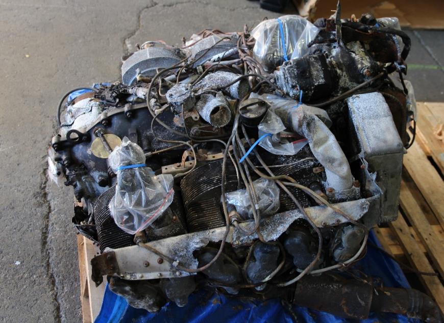 Figure 16: Upright engine assembly viewed from the left side showing extensive fire damage