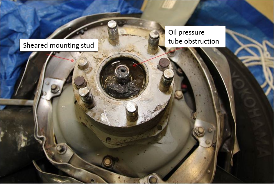 Figure 17: Rear of the propeller hub showing the obstruction of the oil pressure tube by the build-up of grey, solidified substance