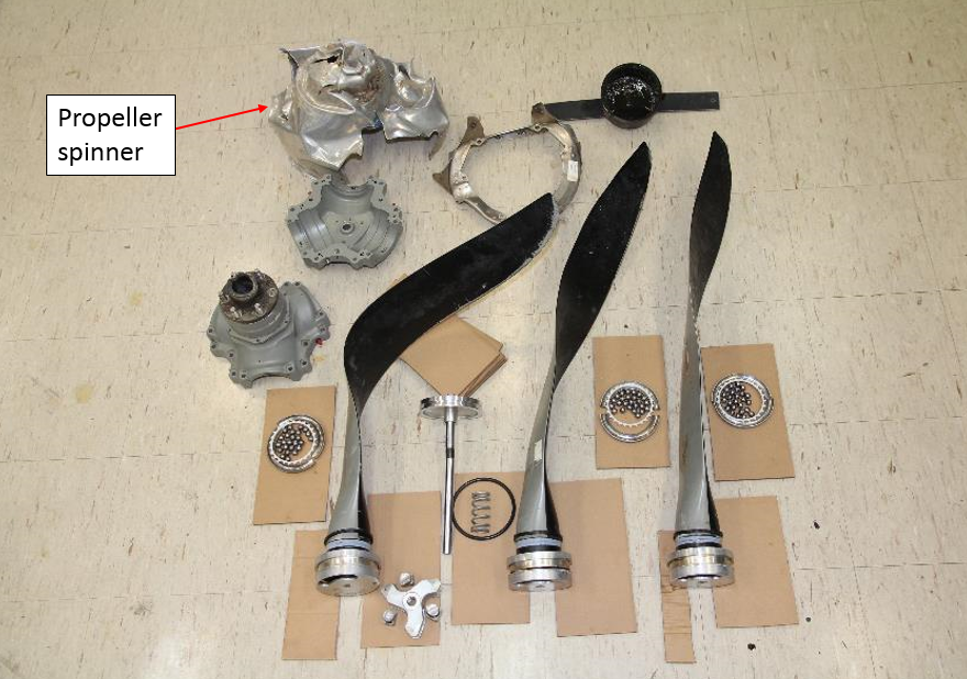 Figure 18: Disassembled propeller showing the propeller blade and spinner damage. Note that the propeller blades are viewed from the trailing edge
