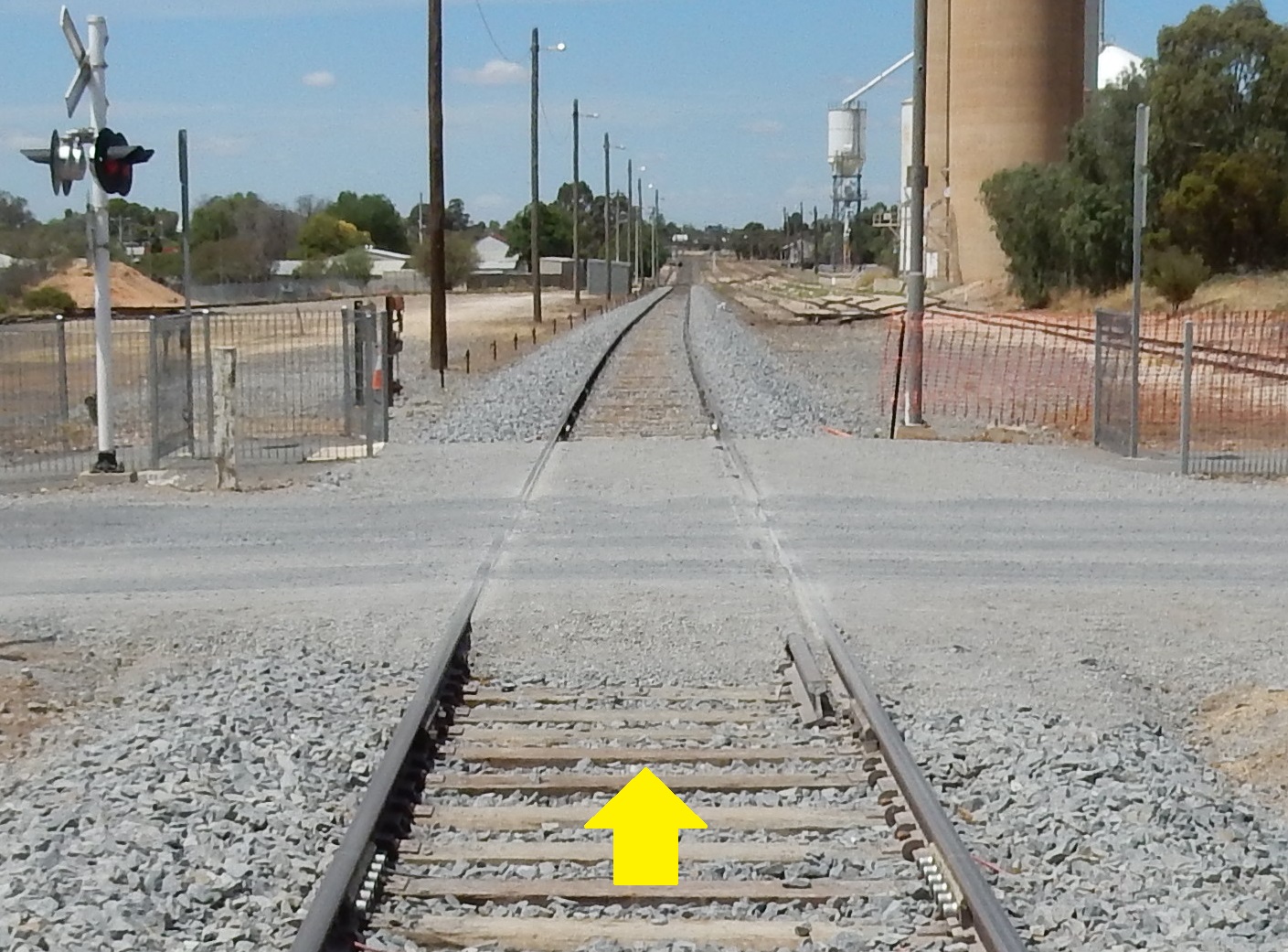 Figure 7: The William Street level crossing after reinstatement, similar in construction to the pre-derailment installation except timber sleepers used instead of concrete.