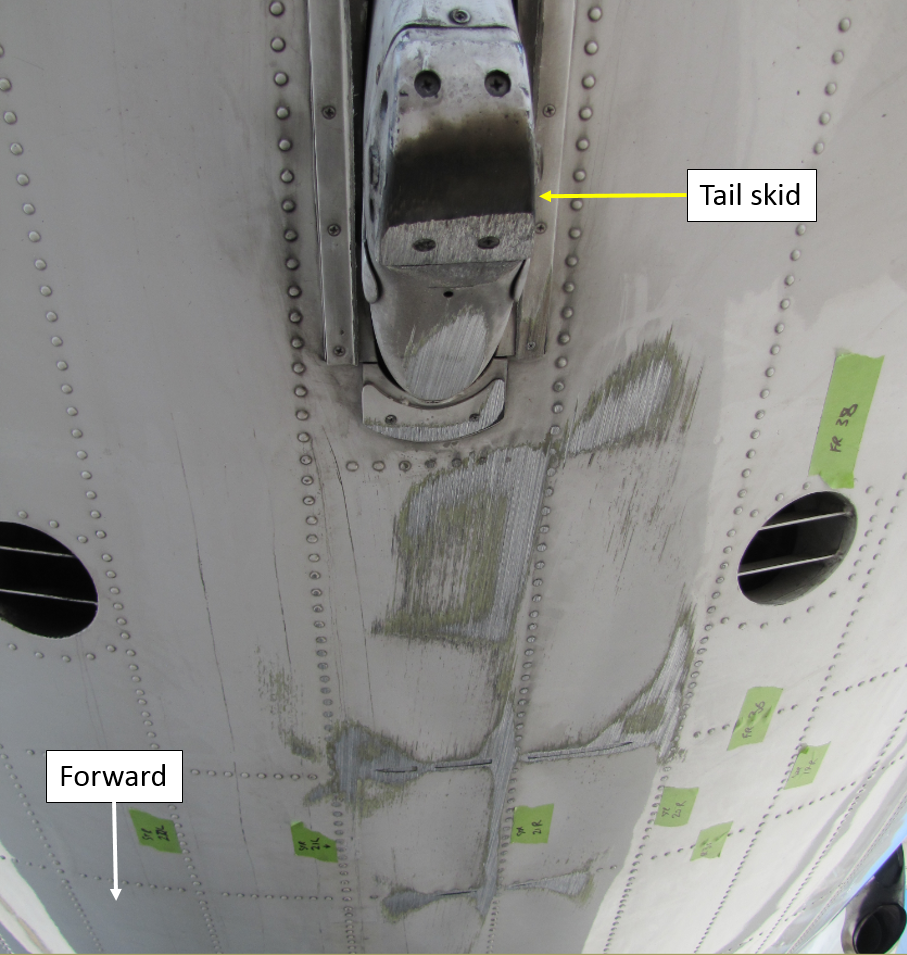 Figure 1: Damage to the tail skid an underside of the rear fuselage