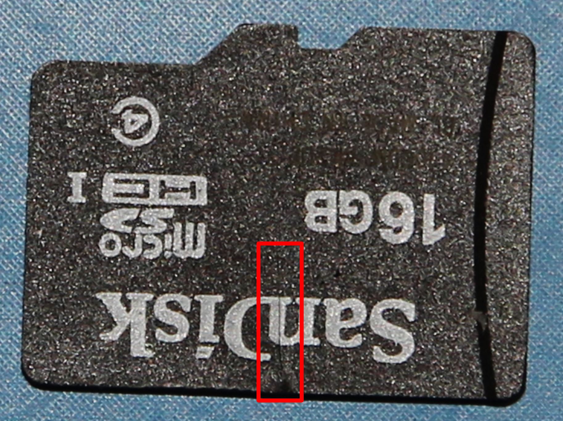 Figure 1: Micro-SD card recovered from the avionics unit with the crack highlighted inside the red box