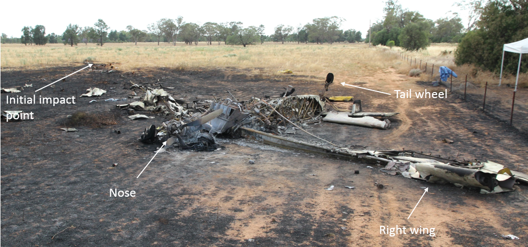 Figure 4: Main wreckage inverted with the nose (engine and propeller) in the foreground