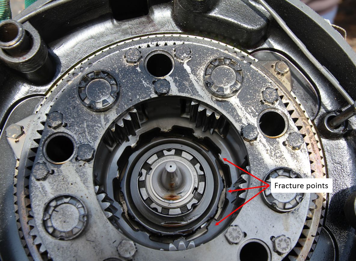 Figure 7: Reduction gearbox drive section viewed from the rear with three of the ten fracture points arrowed