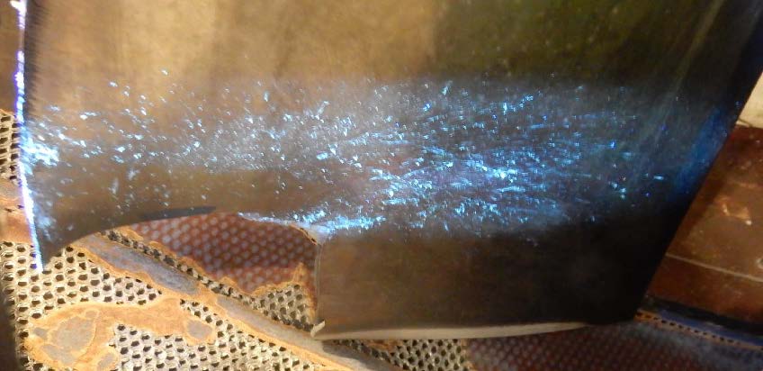 Figure 2: Ultraviolet light showing bird remains on damaged fan blade. Source: Rolls Royce