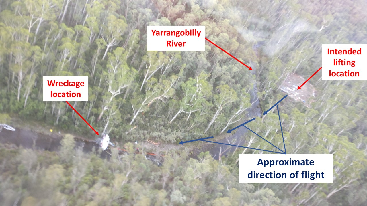 Figure 3: Accident site showing drill pad and helicopter wreckage. Drill pad shown in top right of photo including path of helicopter shown. Source: GHD.