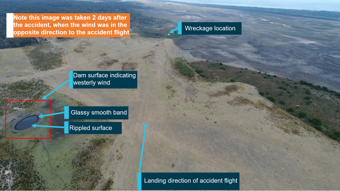 Figure 3: Airfield looking in the landing direction (west) from runway threshold, showing dam surface. Note: image was taken 2 days after the accident, in a westerly wind. Source: ATSB