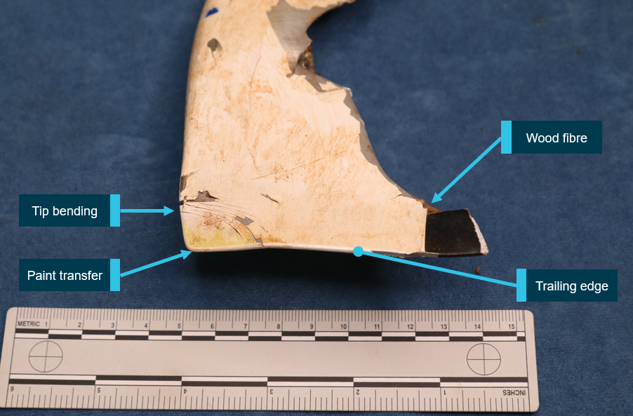 Figure 9: Tail rotor blade tip. Tail rotor blade 2 tip cap with yellow paint transfer from the main rotor and bending deformation.Source: ATSB