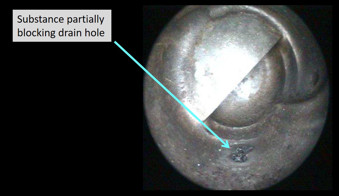Figure 17: Image of substance partially blocking one drain hole in the captain's pitot probe