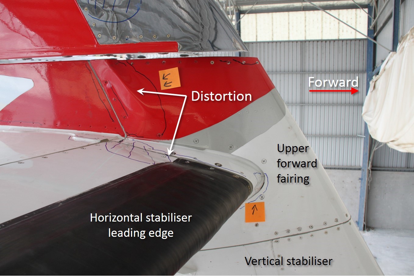 Upper tailplane of VH-FVR showing damage to horizontal and vertical stabilisers that was evident when the damage was identified 5 days and 13 flights after the in-flight upset/pitch disconnect and associated maintenance