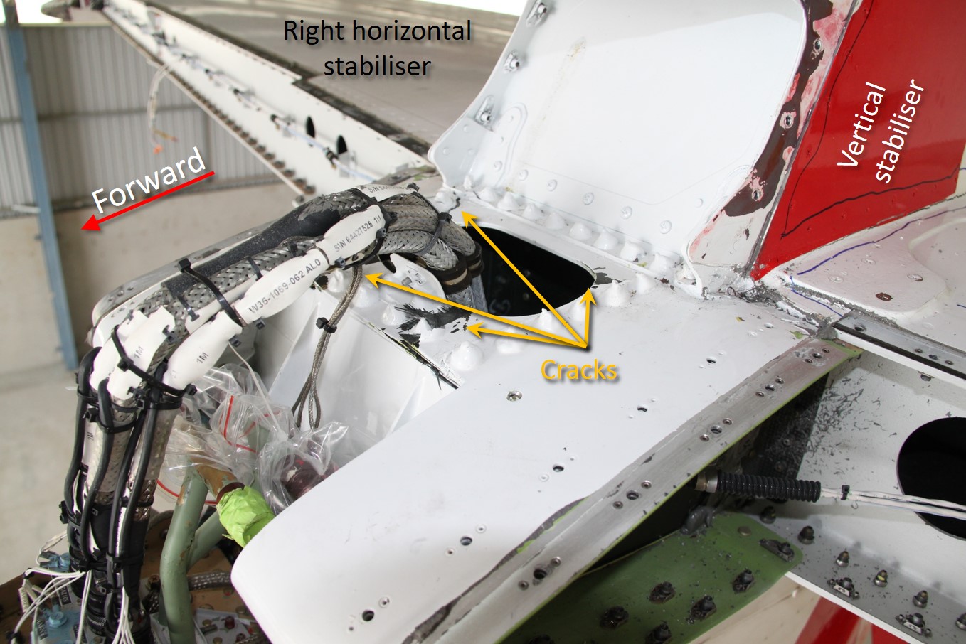 Figure&nbsp;12: Damage in the centre leading edge section above the forward attachment points, included cracking and delamination in all corners of the cut-out and cracks in the ribs (not shown) and deformation of the material around the attachment points (not shown).