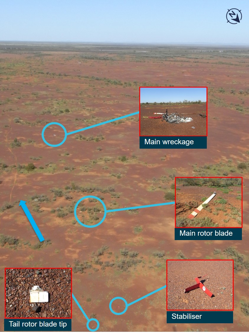 Figure 2: Wreckage distribution showing main body and tail rotor stabiliser assembly, the blue arrow shows direction of travel. Source:  ATSB