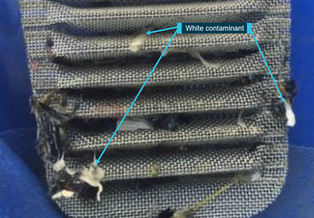 Figure 3: White contaminants in the ‘rock catcher’ – part of the fuel pump system.Source:  Operator, modified by the ATSB