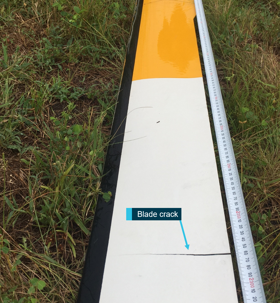 Figure 1: The main rotor blade crack is identified near rotor station 61.The measurement scale positioned along the trailing edge is from the blade tip.Source: North Australian Helicopters, annotated by ATSB