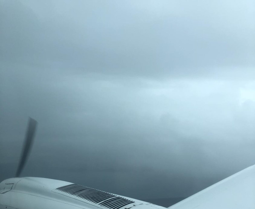 Figure 8: Image recorded by a passenger looking forward over the right engine and sent via text message at 0903.Source: Provided to the ATSB, lower section of image cropped by the ATSB