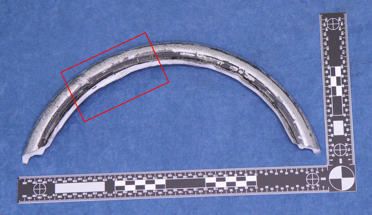 Figure 3: Excised portion of wheel rim with fatigue area highlighted.Source: ATSB