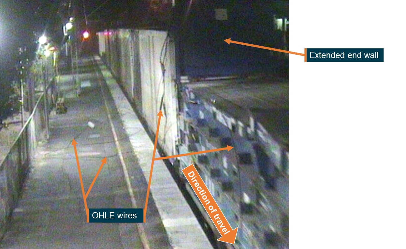 Figure 4: CCTV footage at Cooroy station showing the flat racks with the extended end wall and OHLE wires that had been brought down.
Source: Queensland Rail