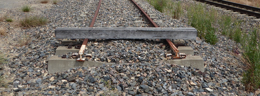 Figure 5: Bordertown siding runaway protection.
Restraining device installed at Bordertown. A rectangular piece of hardwood timber of approximately 300 by 200 mm, bolted to the track, known as a baulk. Source: ATSB