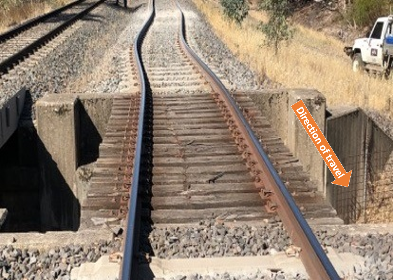 Figure 3: Track misalignment photographed at 1710 on 21 January, after derailment.
Source: Australian Rail Track Corporation
This photograph was taken soon after the derailment in temperatures similar to those existing at the time of the derailment, and prior to the track cooling overnight. It shows a significant track misalignment ahead of the rail bridge.
