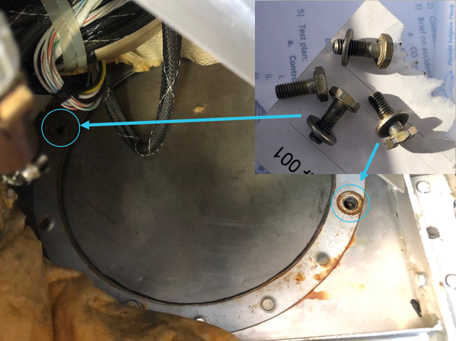 Magneto access panel during testing with bolts removed