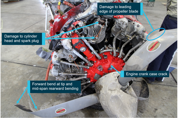 Damage to the engine and propeller, oriented upside down