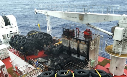 Figure 5: Fire damage on deck including the burnt-out watercraft adjacent to the casing