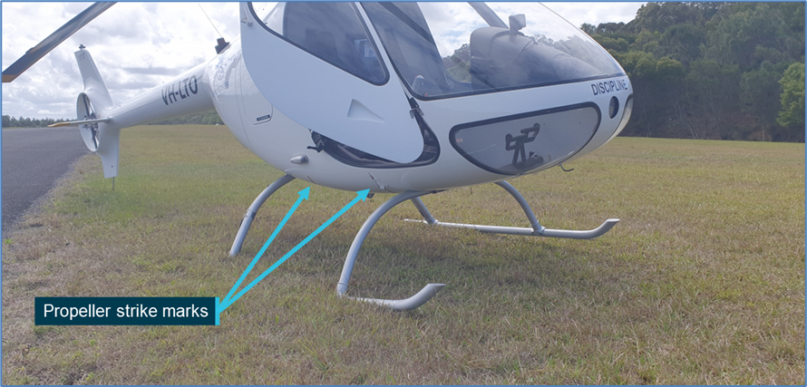 Propeller strike mark and skid damage to VH-LTO