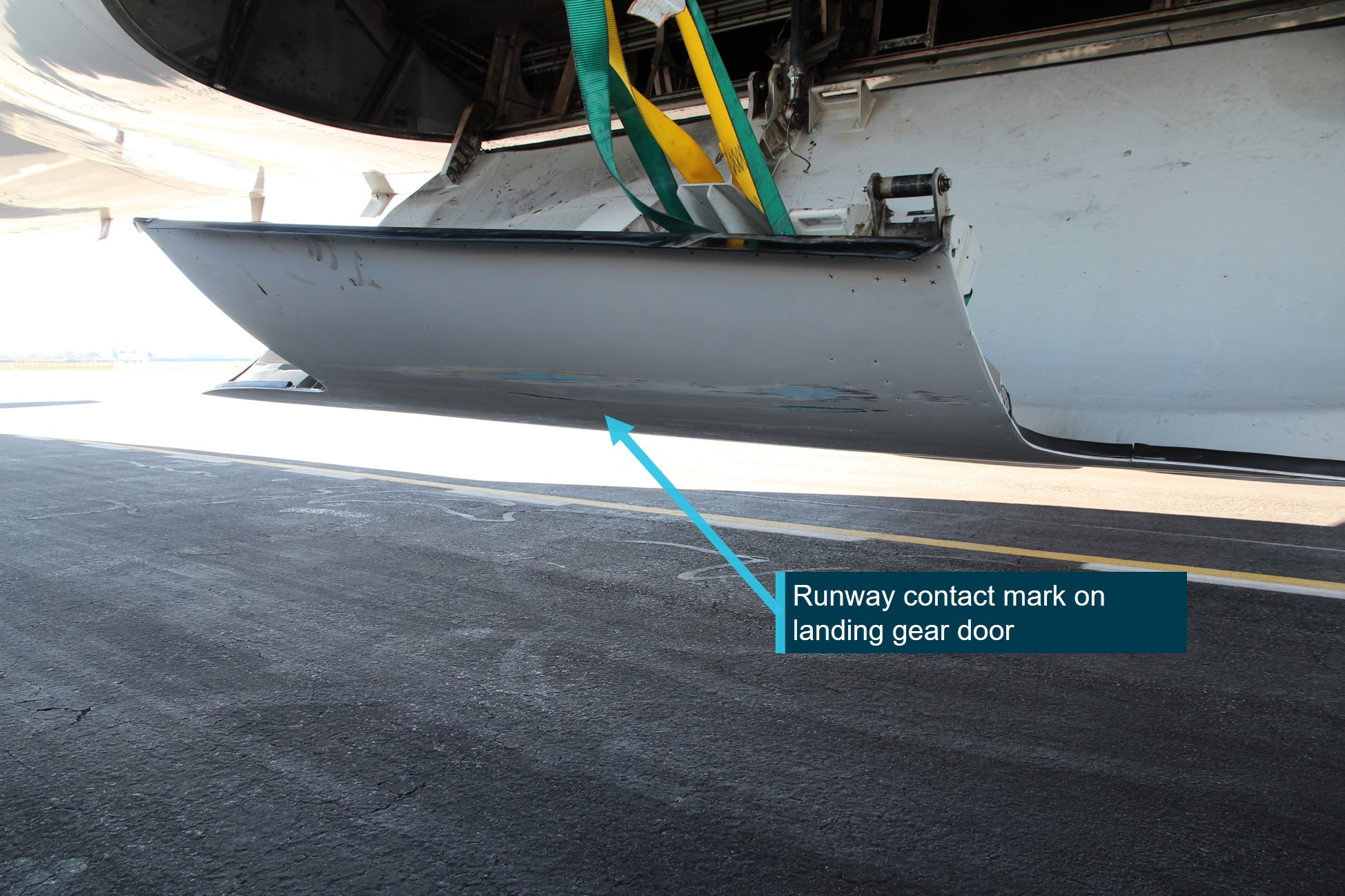 Figure 10: Right main landing gear door showing runway contact mark