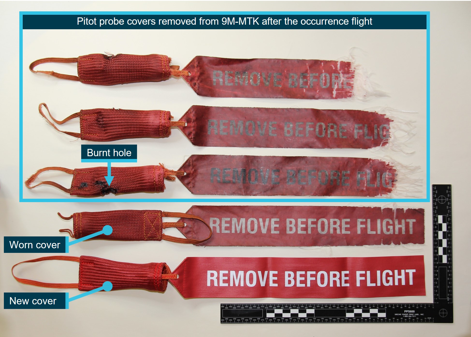 Figure 34: Pitot probe covers removed from 9M-MTK after the occurrence flight, and exemplar covers of the same type