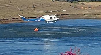 VH-EQW picking up water from the dam just prior the accident