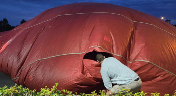 Photograph of tear in balloon envelope.