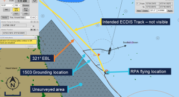 Screenshot from Nuyina ECDIS showing the ship after the grounding, with the track-line indicated in black. Land is indicated in brown to the left of the screenshot and an unsurveyed area is indicated in grey just to the SW of the ship.