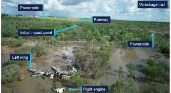 Wreckage trail of VH-PUY. With aircraft wreckage in foreground and trail leading back to the runway at the top of the picture.