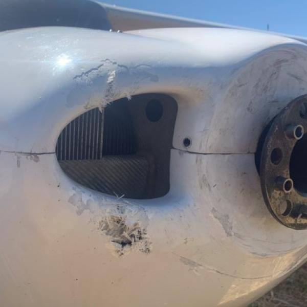 Propeller flange and nose cowl damage 