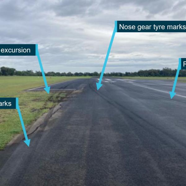 Tyre marks showing runway excursion to the left of runway