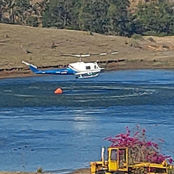 VH-EQW picking up water from the dam just prior the accident