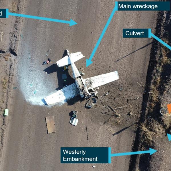 The aircraft came to rest inverted on a mining service road