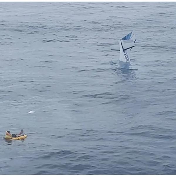 The pilots awaiting rescue in their inflated life raft. Source: RACQ LifeFlight Rescue