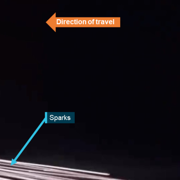 Still image from passenger video capturing sparks emanating from right engine during climb