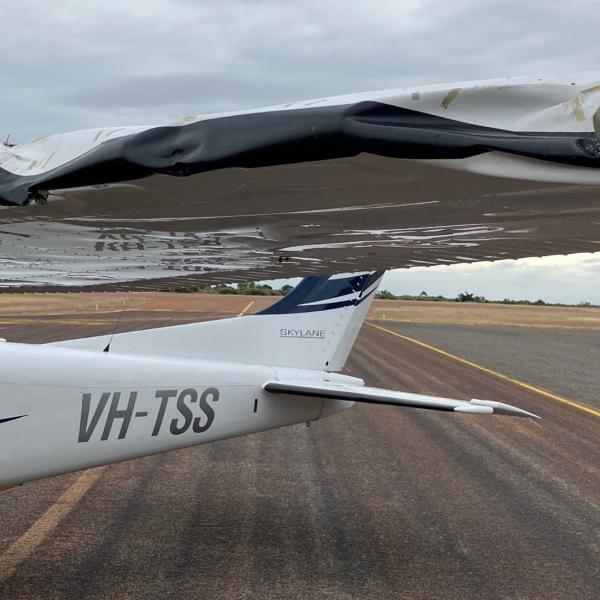 VH-TSS left wing showing significant damage due to impact with the tree