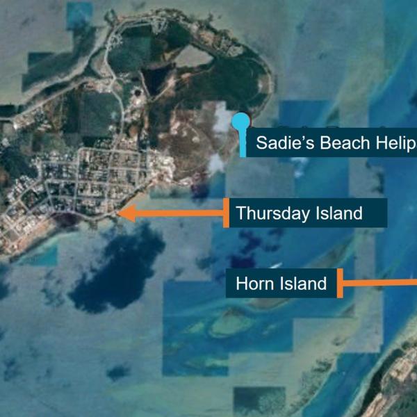 Image of Thursday and Horn Island showing Sadie's Beach Helipad from which the helicopter had just taken off.
