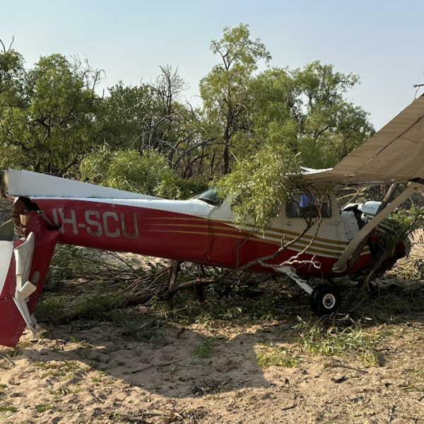 Photograph of the aircraft after the collision with terrain in an upright position with the tail separated.