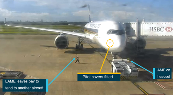 Figure 1: Security footage of bay 81 showing SQ256 4 minutes before pushback with the pitot covers fitted and the LAME moving towards the adjacent bay