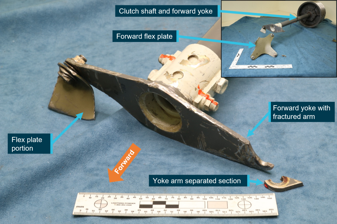 Fractured forward yoke arm with inset showing clutch shaft assembly and flex plate