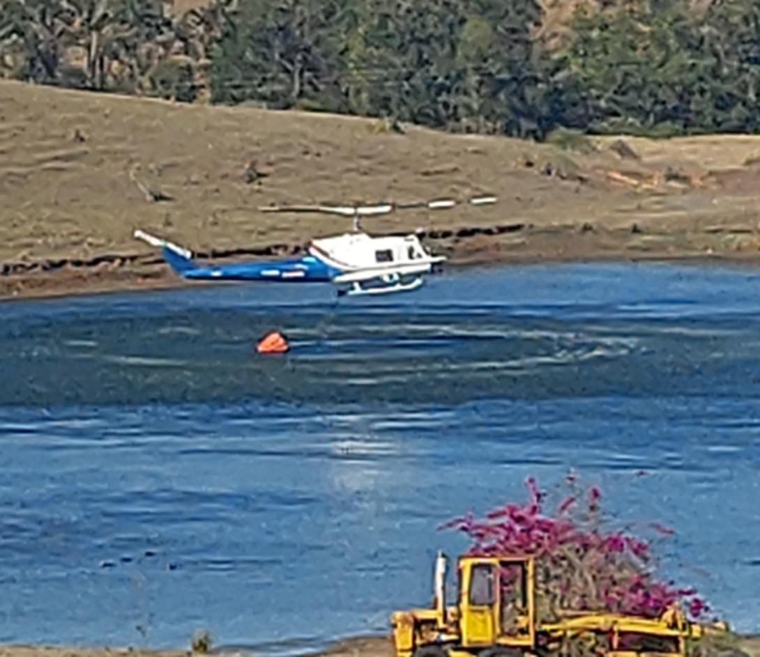 VH-EQW picking up water from the dam just prior the accident