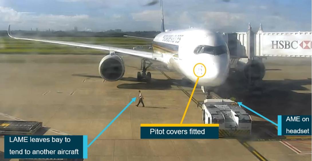 Figure 1: Security footage of bay 81 showing SQ256 4 minutes before pushback with the pitot covers fitted and the LAME moving towards the adjacent bay