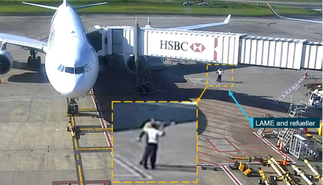 Figure 2: Security footage of the refueller pointing towards SQ256 and informing the LAME that the pitot covers were fitted