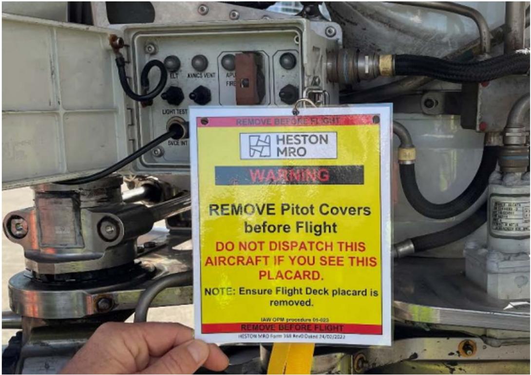 Figure 8: Warning placard fitted to the ground communication panel