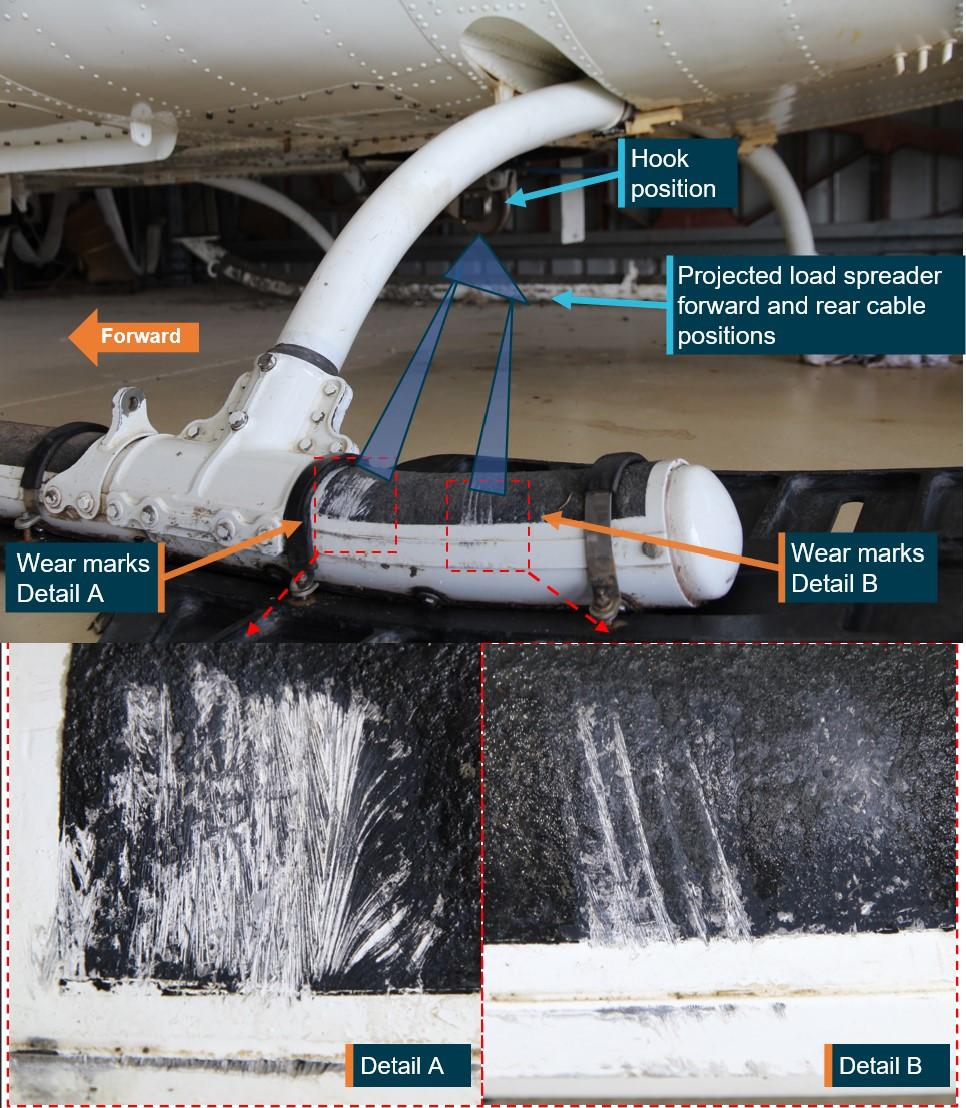 Figure 9: Outboard of left rear skid showing hook position and likely position of spreader with forward and rear cables aligned with wear damage